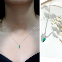 Marquise cut emerald solitaire pendant necklace by Rosec Jewels featuring a green emerald gemstone on a delicate chain