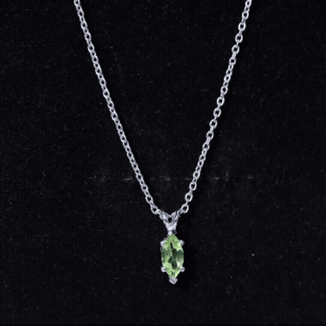 Marquise cut peridot birthstone pendant on silver chain, featuring a 0.74 carat green gemstone from Rosec Jewels.