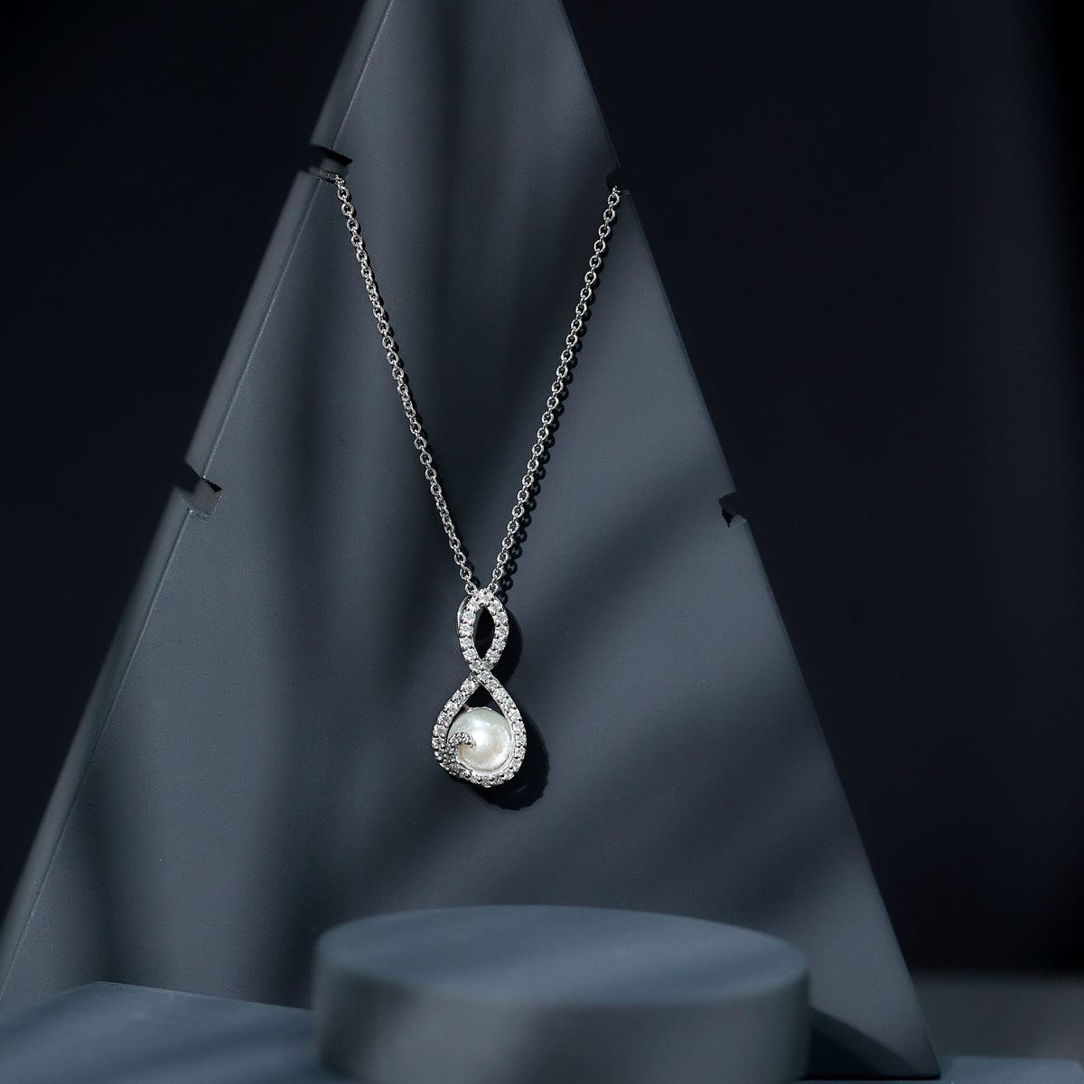 Freshwater White Pearl and Moissanite Infinity Pendant in Silver