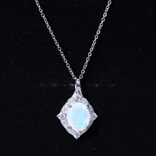 Oval cut rainbow opal pendant with Moissanite halo, art deco style jewelry by Rosec Jewels featuring a 1.3 carat gemstone.