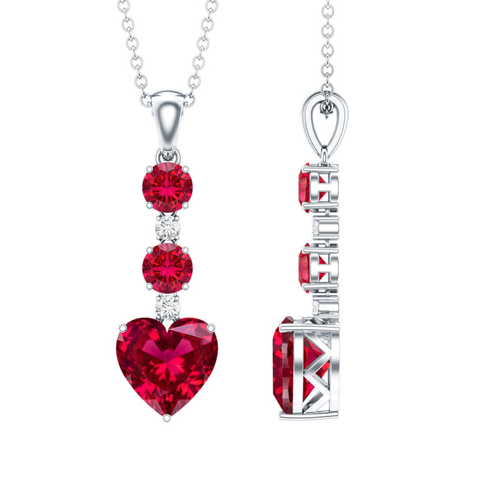Lab grown 2 carat ruby heart pendant on silver chain by Rosec Jewels, showcasing a sparkling ruby heart pendant.
