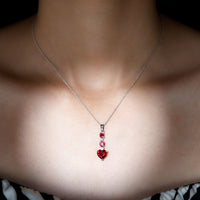 Created Ruby and Moissanite Heart Dangle Pendant Necklace