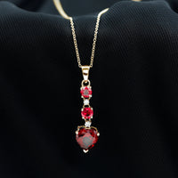 Created Ruby and Moissanite Heart Dangle Pendant Necklace
