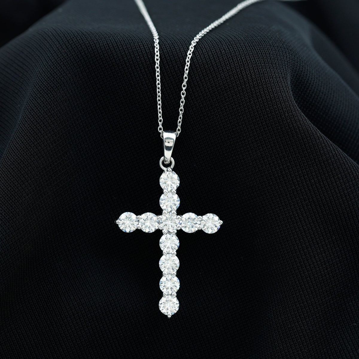Round moissanite cross pendant necklace from Rosec Jewels, featuring a sparkling circular cross design on a delicate chain.