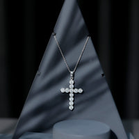 Rosec Jewels certified round moissanite cross pendant necklace with a sleek, elegant design displayed against a neutral background.