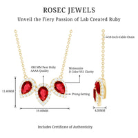Pear cut lab-created ruby three-stone pendant with moissanite halo, featuring elegant jewelry design from Rosec Jewels.