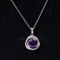 Natural amethyst and diamond swirl pendant necklace from Rosec Jewels, showcasing a pendant with purple amethyst and sparkling diamonds.