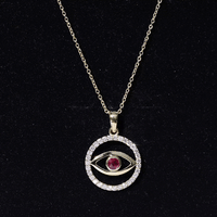 Yellow gold evil eye pendant necklace featuring real ruby and diamond accents by Rosec Jewels.