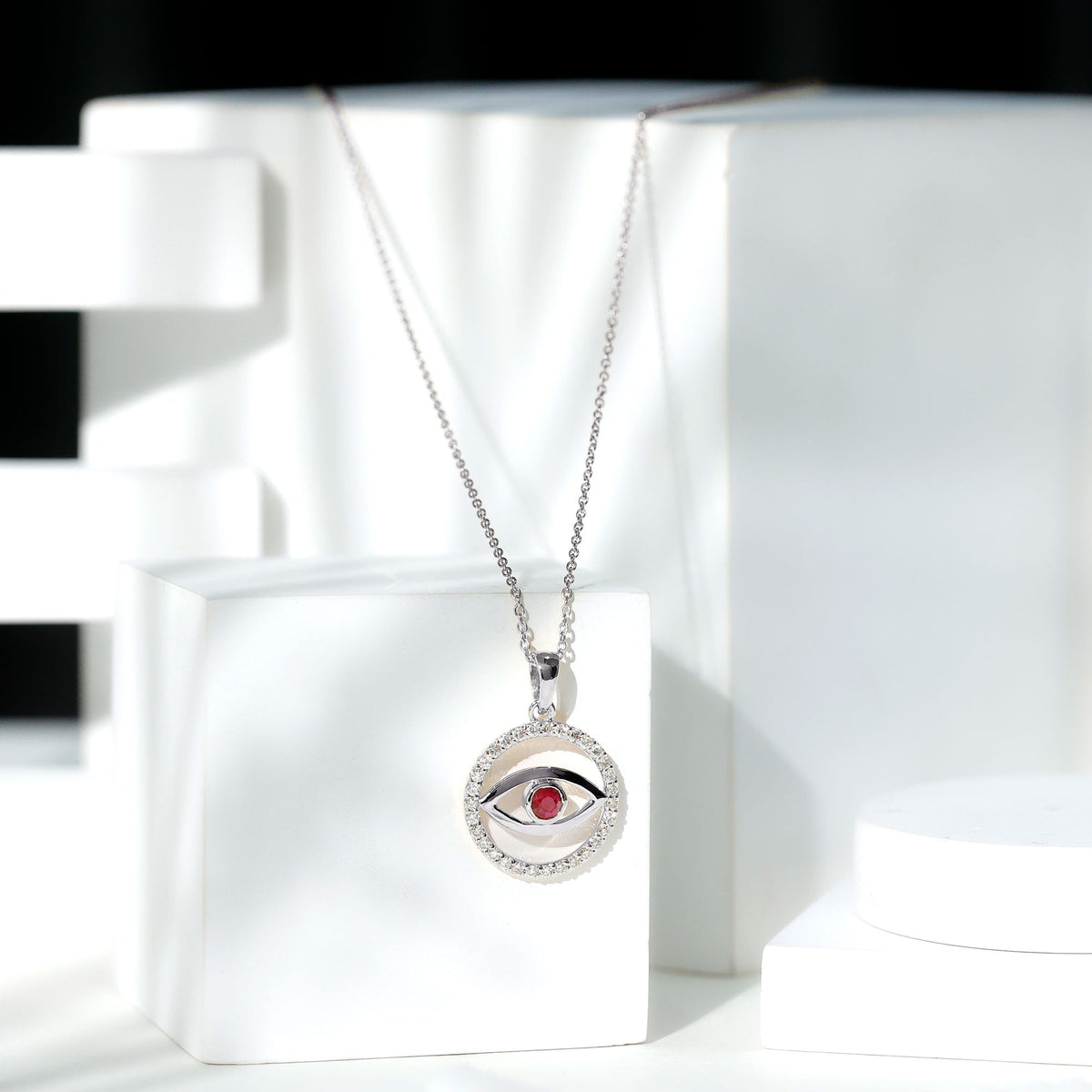 Real ruby and diamond evil eye pendant necklace from Rosec Jewels featuring a striking eye-shaped pendant with vibrant ruby and sparkling diamonds.