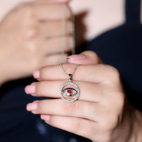 Real ruby and diamond evil eye pendant necklace from Rosec Jewels featuring a circular pendant with red ruby and sparkling diamonds.