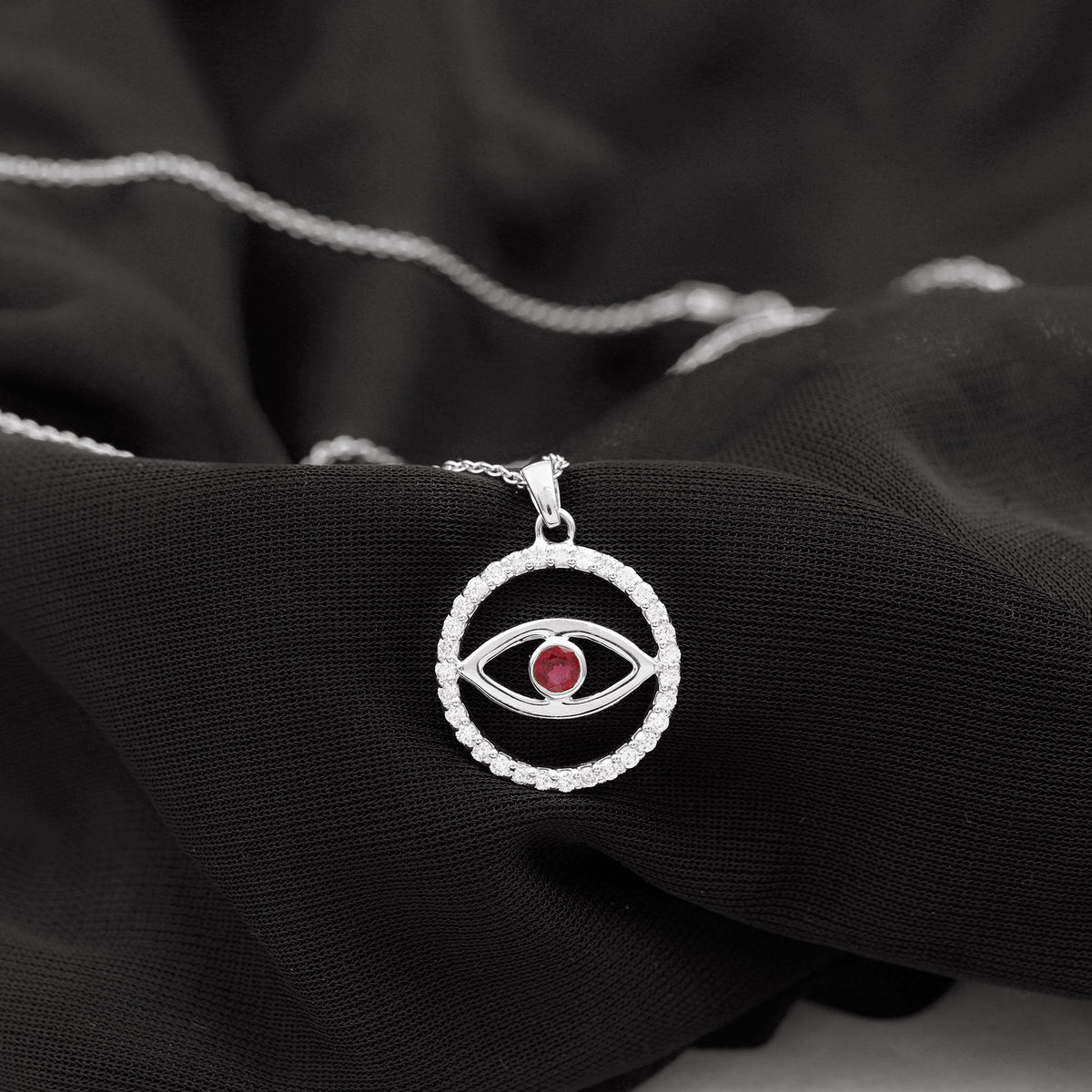 Real ruby and diamond evil eye pendant necklace featuring a gold chain and intricate detailing, from Rosec Jewels.
