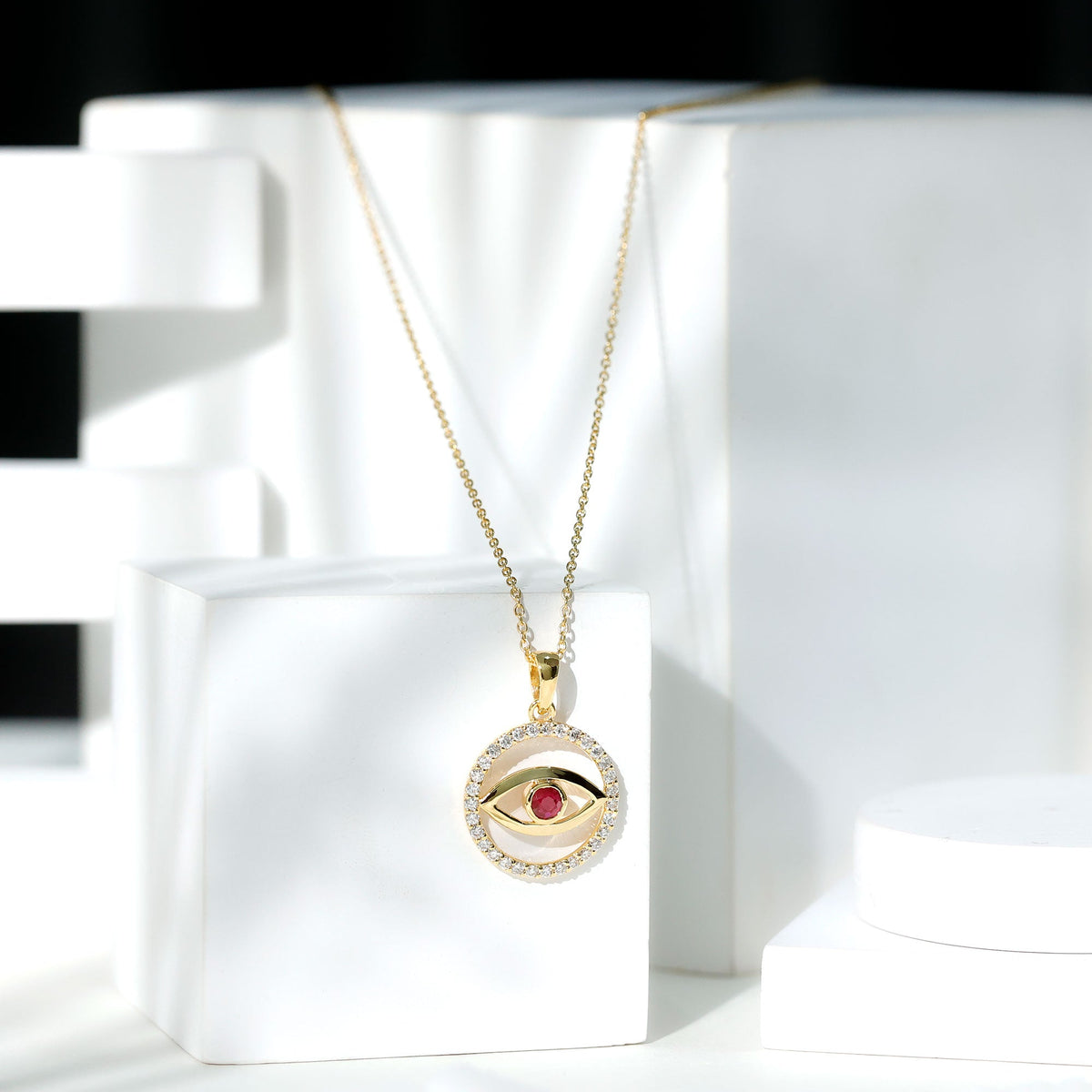 Real ruby and diamond evil eye pendant necklace from Rosec Jewels, featuring a striking design with vibrant gemstones.