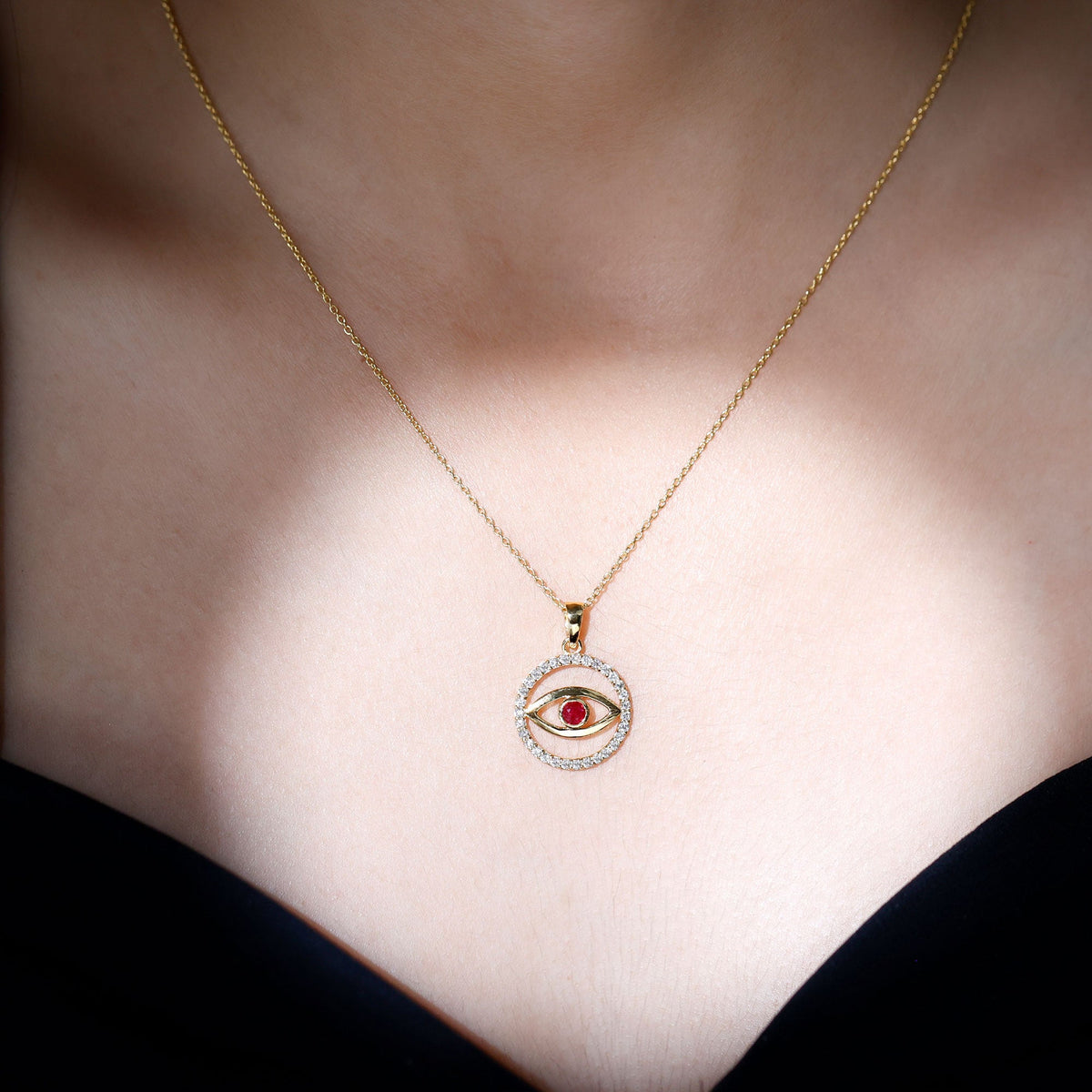 Real ruby and diamond evil eye pendant necklace by Rosec Jewels with intricate pendant design and sparkling gemstones.