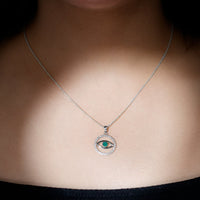 Real emerald and diamond evil eye pendant necklace from Rosec Jewels featuring a detailed gold pendant with sparkling gemstones.