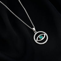 Real emerald and diamond evil eye pendant necklace by Rosec Jewels featuring a vibrant green emerald with sparkling diamonds.