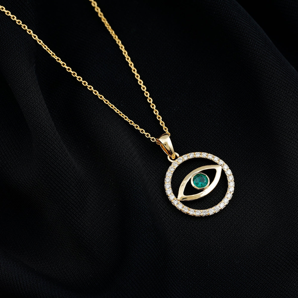 Real emerald and diamond evil eye pendant necklace by Rosec Jewels featuring vibrant green gemstones and sparkling diamonds.