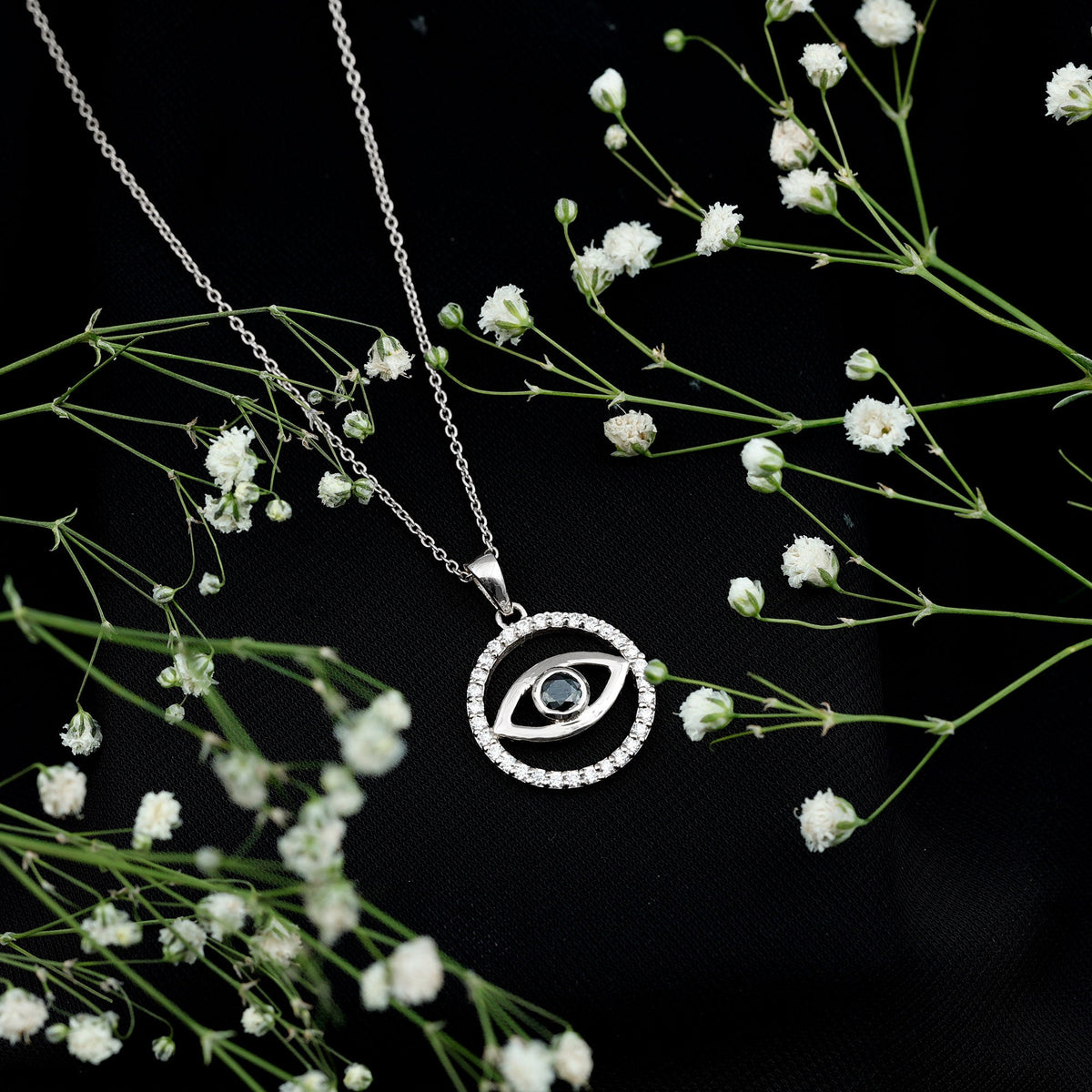 Black Onyx Evil Eye pendant with sparkling Moissanite eternity circle, featuring a protective design by Rosec Jewels.