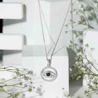 Black Onyx evil eye pendant with moissanite eternity circle, crafted by Rosec Jewels, featuring a protective and elegant design.