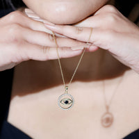Black Onyx evil eye pendant with moissanite eternity circle, featuring a protective jewelry design from Rosec Jewels.
