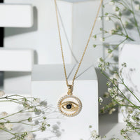 Black Onyx Evil Eye pendant with moissanite eternity circle, elegant jewelry piece from Rosec Jewels.
