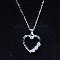 Simple moissanite open heart pendant necklace by Rosec Jewels featuring a sparkling heart-shaped design on a delicate chain.