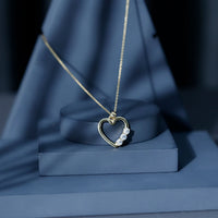 Simple moissanite open heart pendant necklace by Rosec Jewels featuring a sparkling heart-shaped gemstone on a delicate chain.