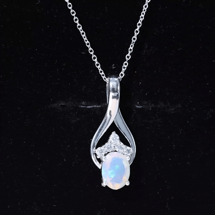 Natural oval Ethiopian opal and moissanite teardrop pendant necklace with chain, showcasing vibrant gemstone and elegant design.