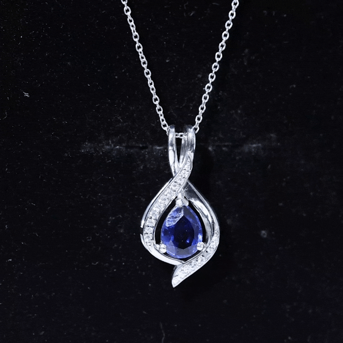 Blue sapphire teardrop pendant with moissanite from Rosec Jewels, featuring a 6x8 mm lab-grown gemstone and elegant silver setting.
