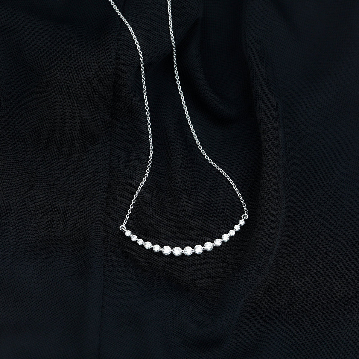 Moissanite curved bar pendant necklace for women by Rosec Jewels, featuring a sleek, elegant design with sparkling stones.