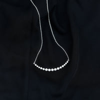 Moissanite curved bar pendant necklace for women by Rosec Jewels, featuring a sleek, elegant design with sparkling stones.