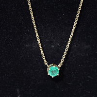 Yellow gold pendant with a 5mm round cut solitaire emerald gemstone set in a 6-prong setting by Rosec Jewels