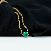 5mm round cut emerald solitaire pendant in a 6 prong setting by Rosec Jewels, showcasing a elegant green gemstone necklace.