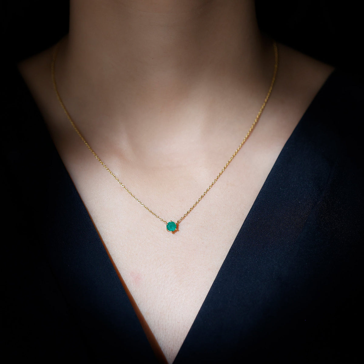 Round cut emerald pendant in 6 prong setting with 5mm solitaire, crafted by Rosec Jewels.
