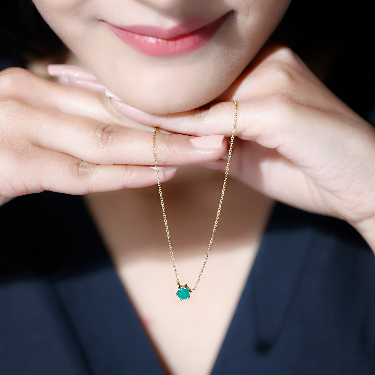 Round cut emerald pendant in 6 prong setting, featuring a 5mm solitaire emerald gemstone in a classic jewelry pendant.