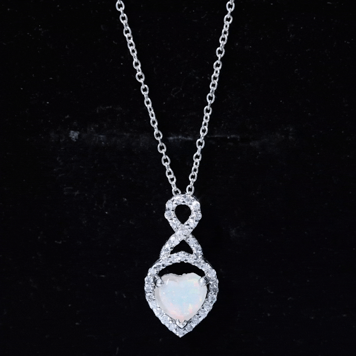 Heart-shaped Ethiopian opal infinity pendant with diamonds, featuring a 2-carat opal and sparkling accents from Rosec Jewels.