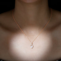 Heart-shaped Ethiopian opal infinity pendant with diamonds by Rosec Jewels, showcasing a 2-carat opal and sparkling accents.