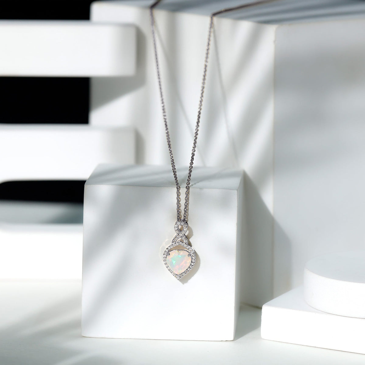 Heart-shaped Ethiopian opal infinity pendant with diamonds, from Rosec Jewels, showcasing the elegant pendant design.