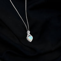 Heart-shaped Ethiopian opal infinity pendant with diamonds, featuring 2 carats of vibrant gemstones, by Rosec Jewels.
