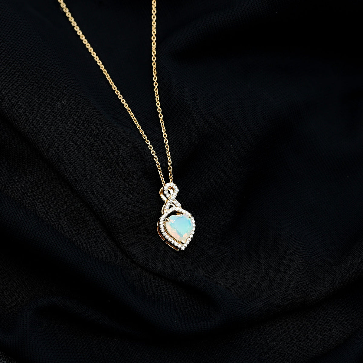 Heart-shaped Ethiopian opal infinity pendant with diamonds, featuring 2-carat opal and delicate chain from Rosec Jewels.