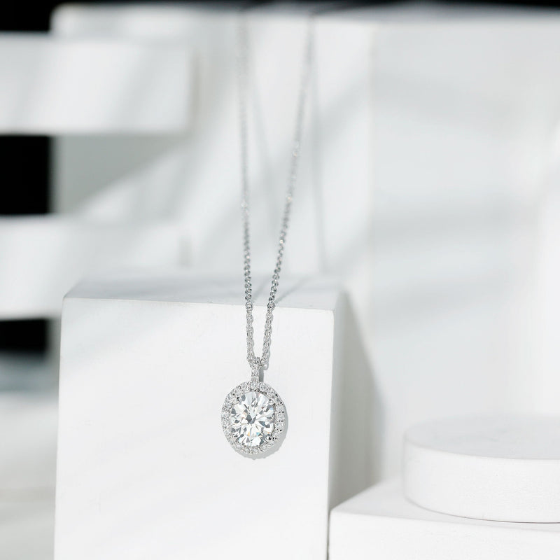 Oval cubic zirconia halo pendant with chain, crafted by Rosec Jewels, featuring a sparkling 8x10 mm zirconia stone.