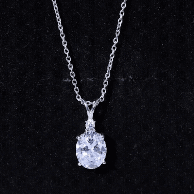 Certified 4 Carat Oval Cubic Zirconia pendant necklace with silver chain from Rosec Jewels, showcasing a sparkling oval zirconia stone.