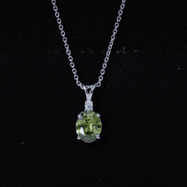 Oval-shaped green sapphire pendant necklace with 4-carat lab-grown gemstone, set in a elegant solitaire design by Rosec Jewels.