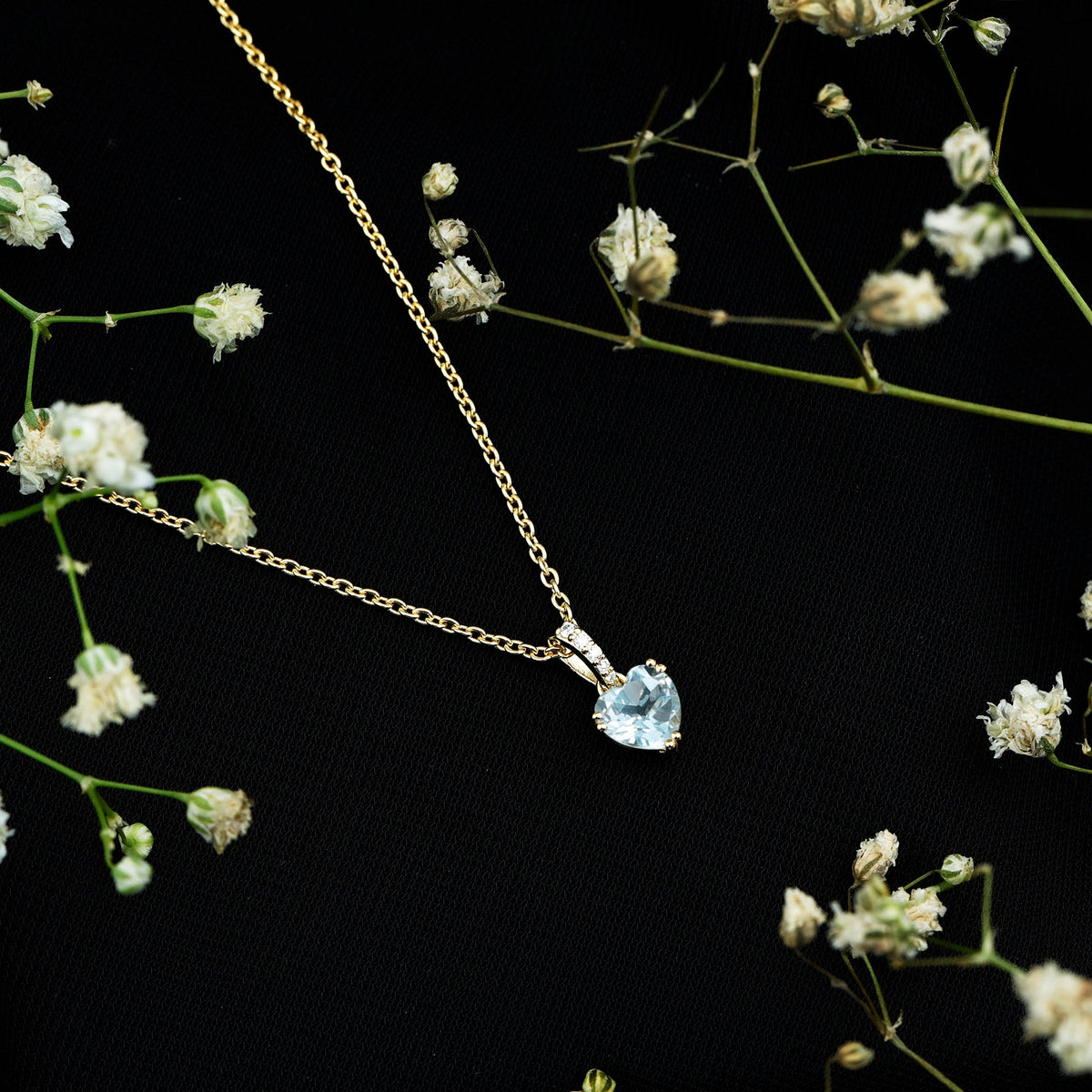 Swiss Blue Topaz and diamond heart pendant on chain, jewelry piece with 0.9 carat topaz and sparkling accents.