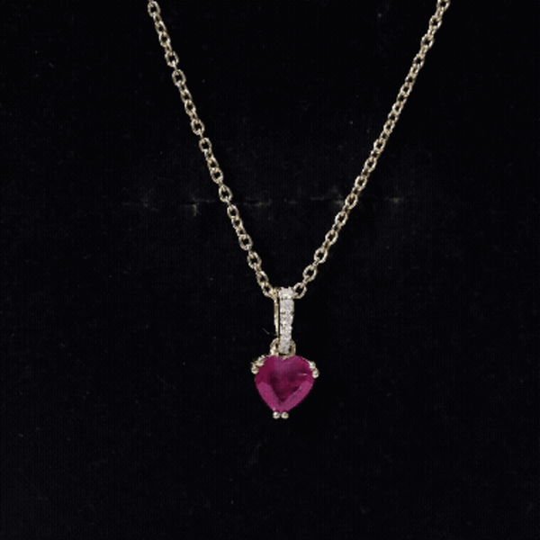 Natural 1 Carat Ruby Heart Pendant with Diamond Bail by Rosec Jewels, featuring a yellow gold setting and detailed craftsmanship.