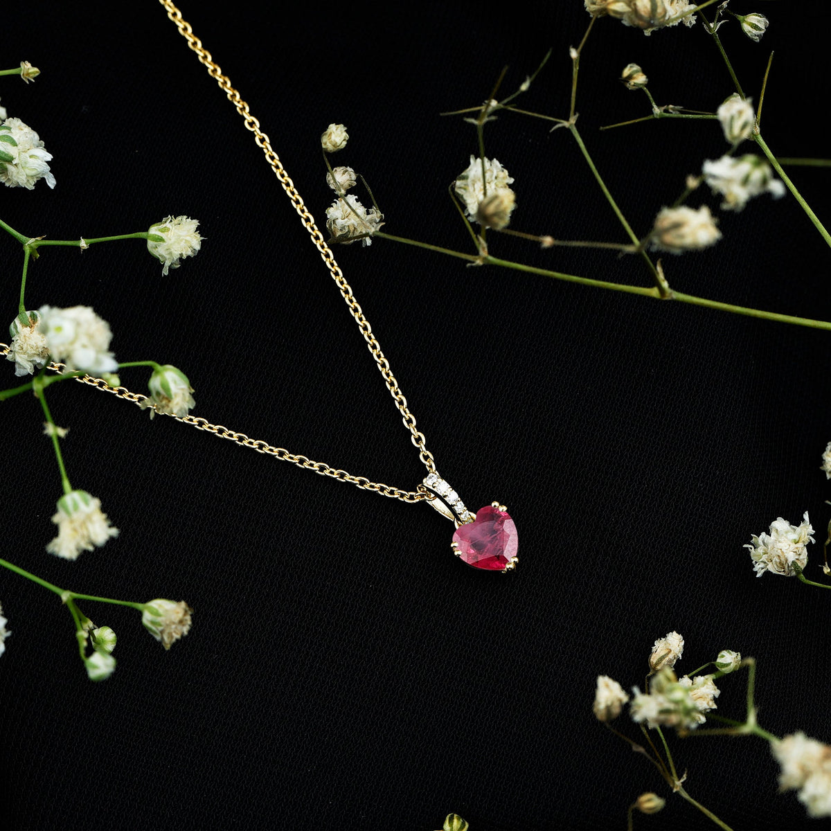 Natural 1 Carat Ruby Heart Pendant with Diamond Bail by Rosec Jewels, featuring a sparkling ruby heart and elegant diamond accents.