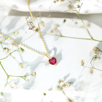Natural 1 carat ruby heart pendant with diamond bail by Rosec Jewels, showcasing a sparkling ruby heart and elegant pendant design.