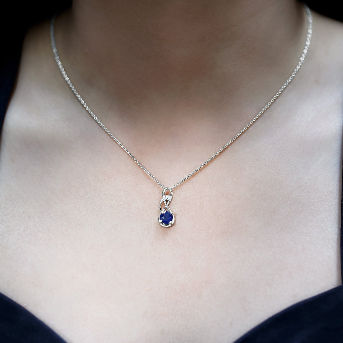 Natural 1 Carat blue sapphire infinity pendant on silver chain from Rosec Jewels, showcasing a elegant blue sapphire design.
