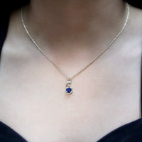 Natural 1 Carat blue sapphire infinity pendant on silver chain from Rosec Jewels, showcasing a elegant blue sapphire design.