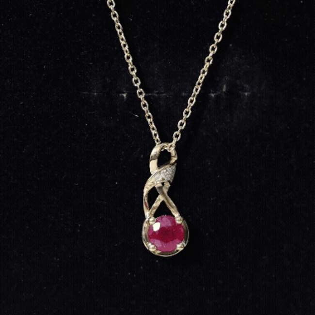 Natural 1.5 carat ruby and diamond infinity pendant necklace with a silver chain by Rosec Jewels.