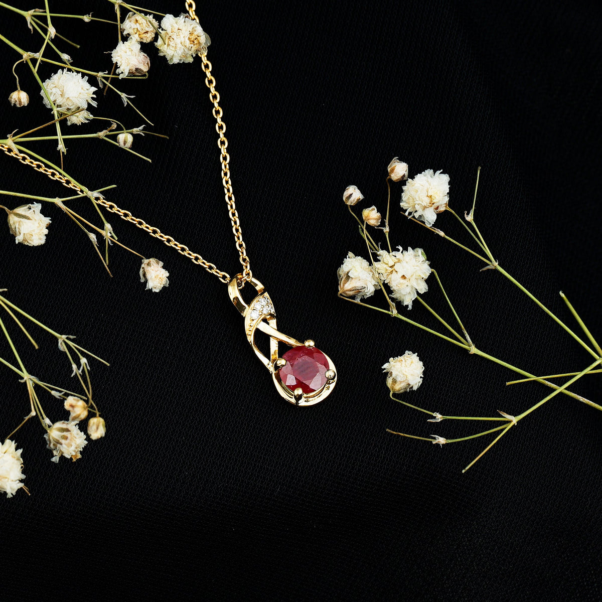 Natural 1.5 Carat Ruby and Diamond infinity pendant on silver chain by Rosec Jewels, showcasing the elegant jewelry design.